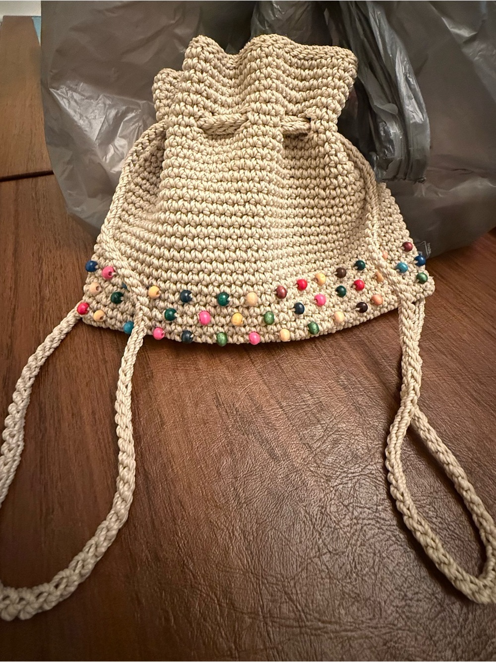 The Sak Cream Crochet Drawstring Bag with Multicolor Bead Trim